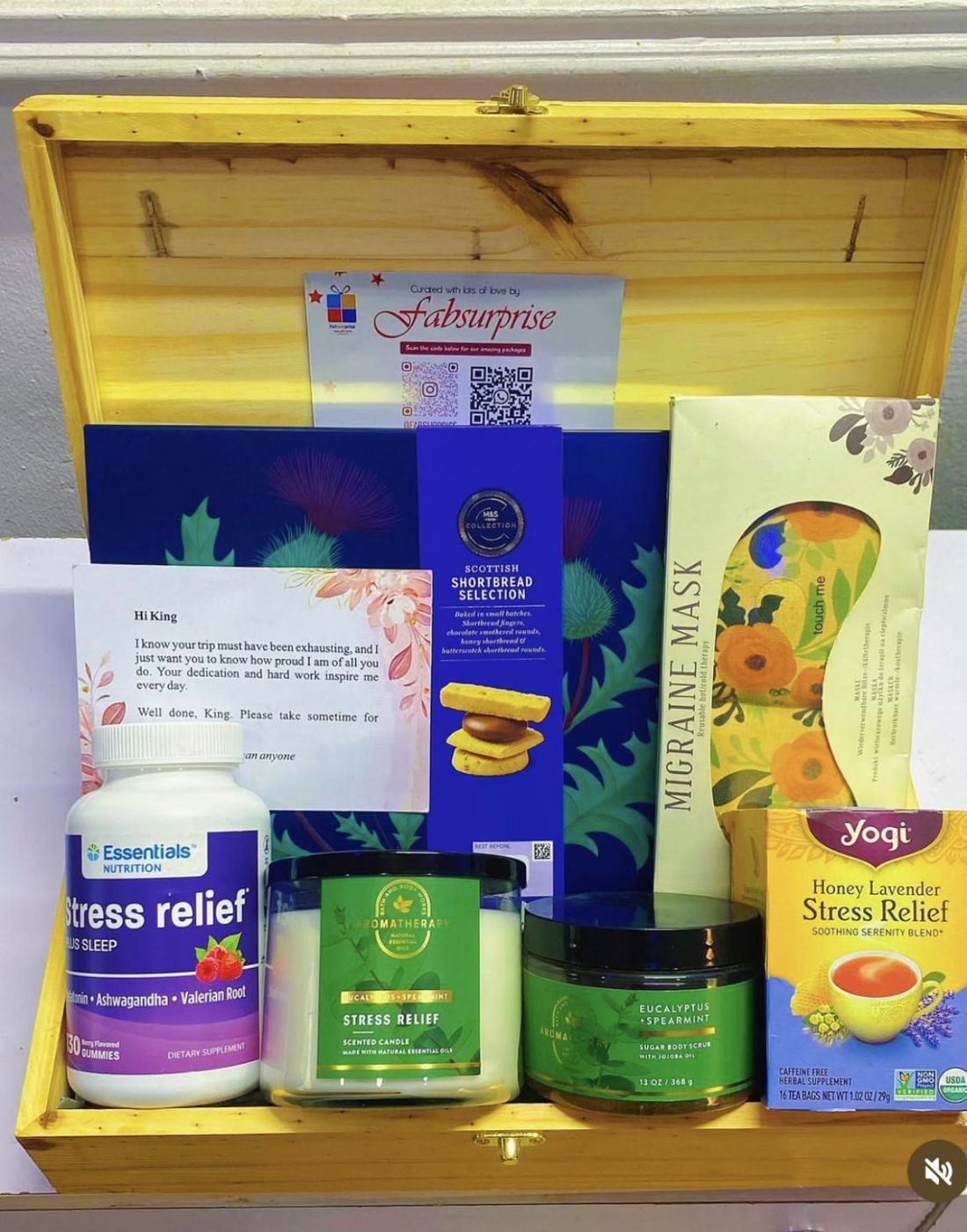 Open gift box with a handwritten note and self-care items
