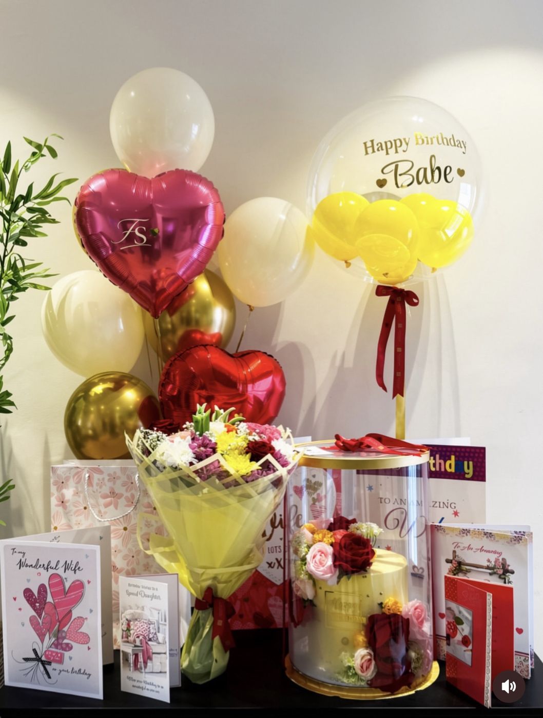 Personalised 'Happy Birthday Babe' balloon with heart balloons, flowers and a gift box